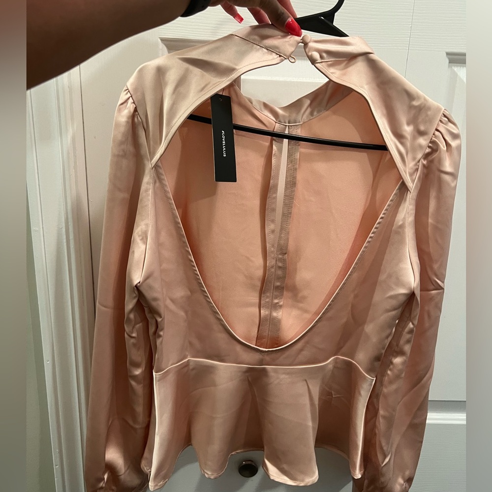 LuLu’s open back silk blouse